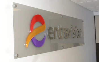 A standoff mounted interior sign panel with raised characters