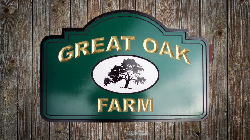 great oak carved farm sign