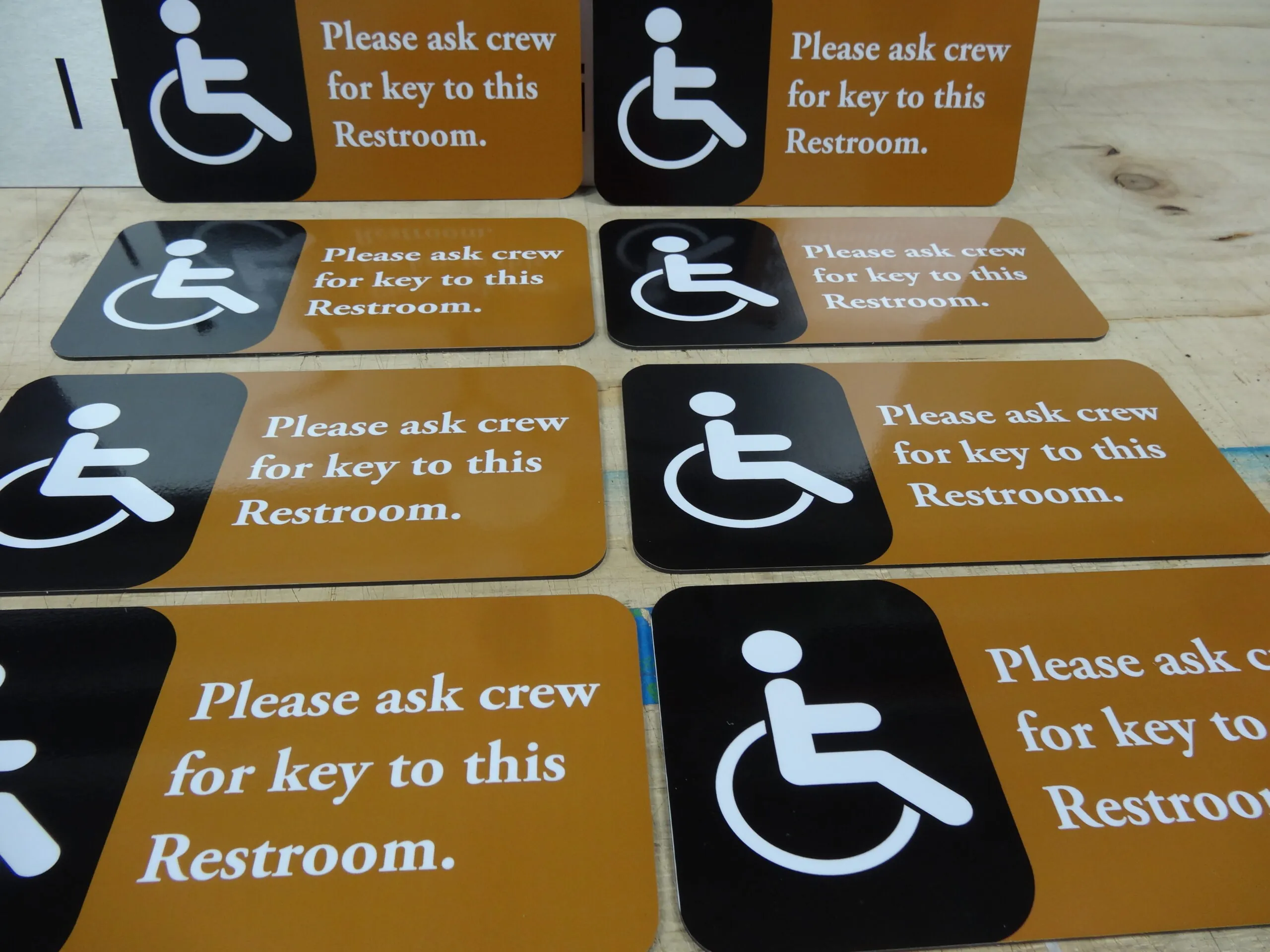 Accessible restroom signs produced as a set for a building's common areas