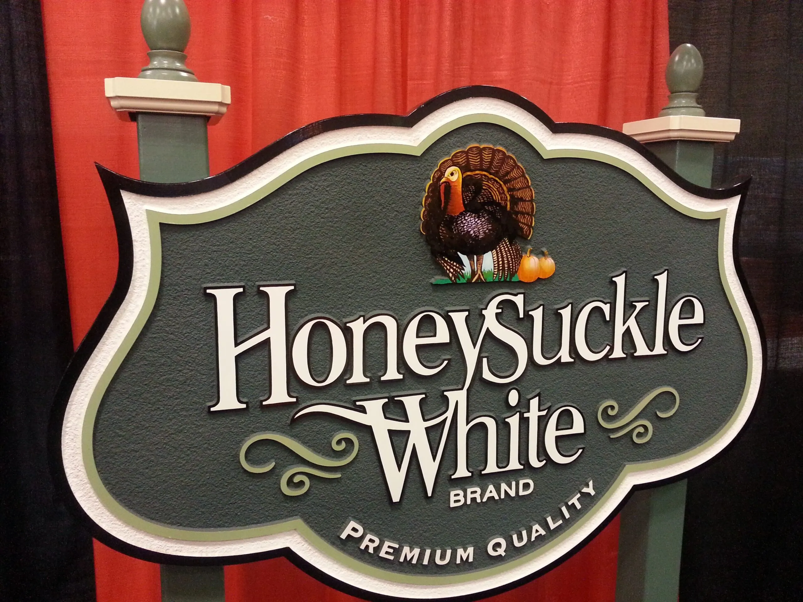 carved sign for honeysuckle white