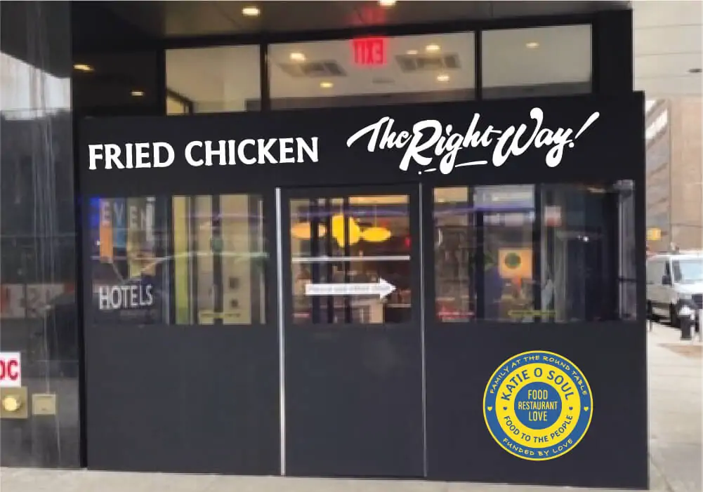 Black winter vestibule printed with Fried Chicken The Right Way and a directional arrow at a restaurant entrance