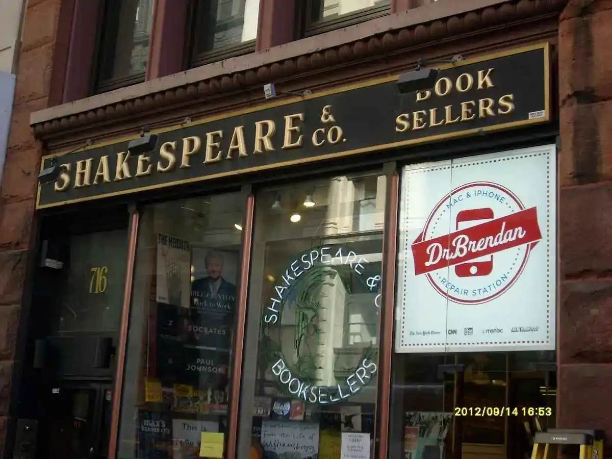 Traditional painted storefront sign over a bookshop