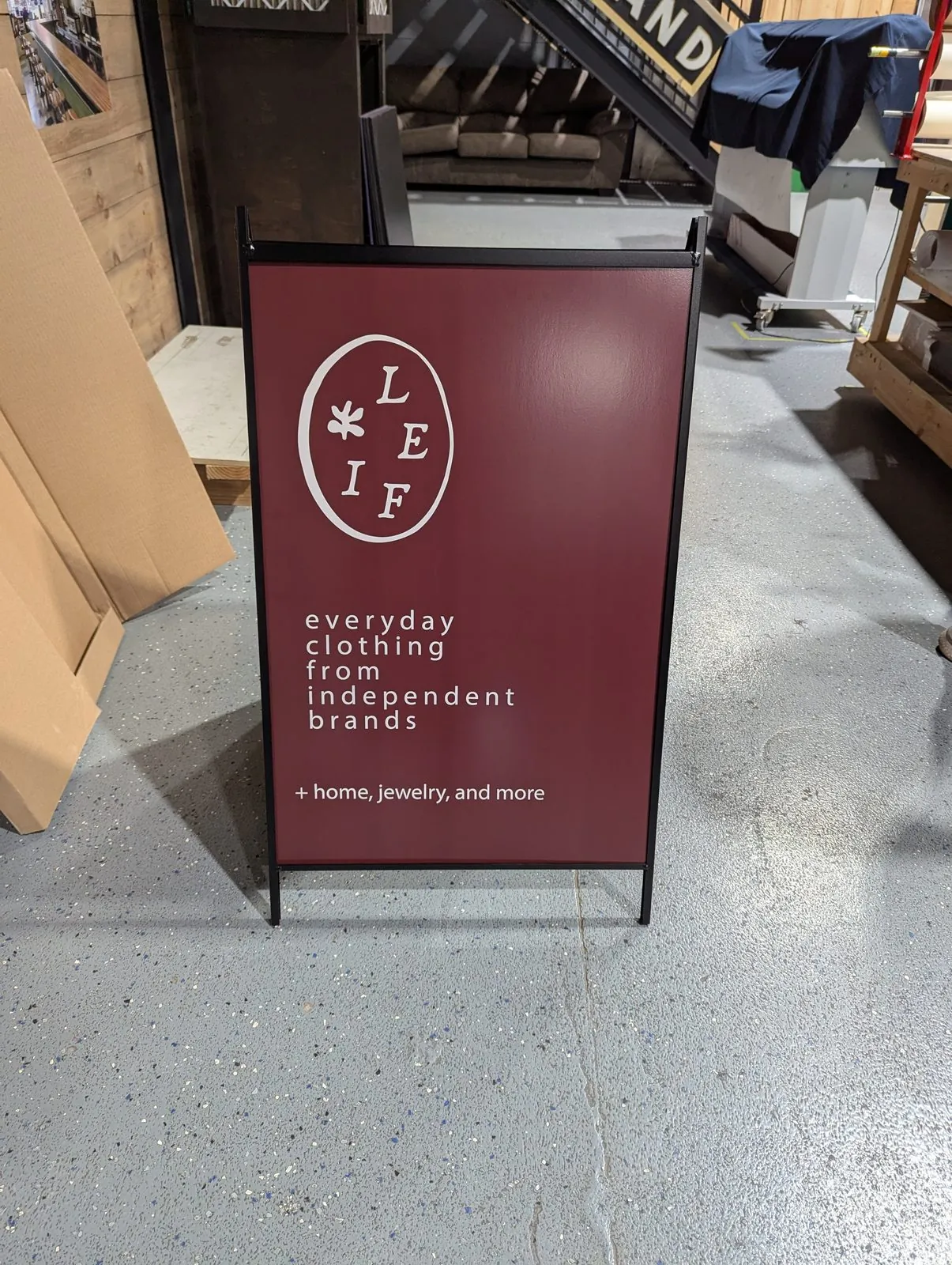 Burgundy A frame face with a round logo and white text