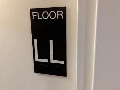 ADA floor level sign inside a stairwell