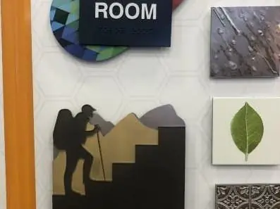 ADA room sign with custom pictogram graphics