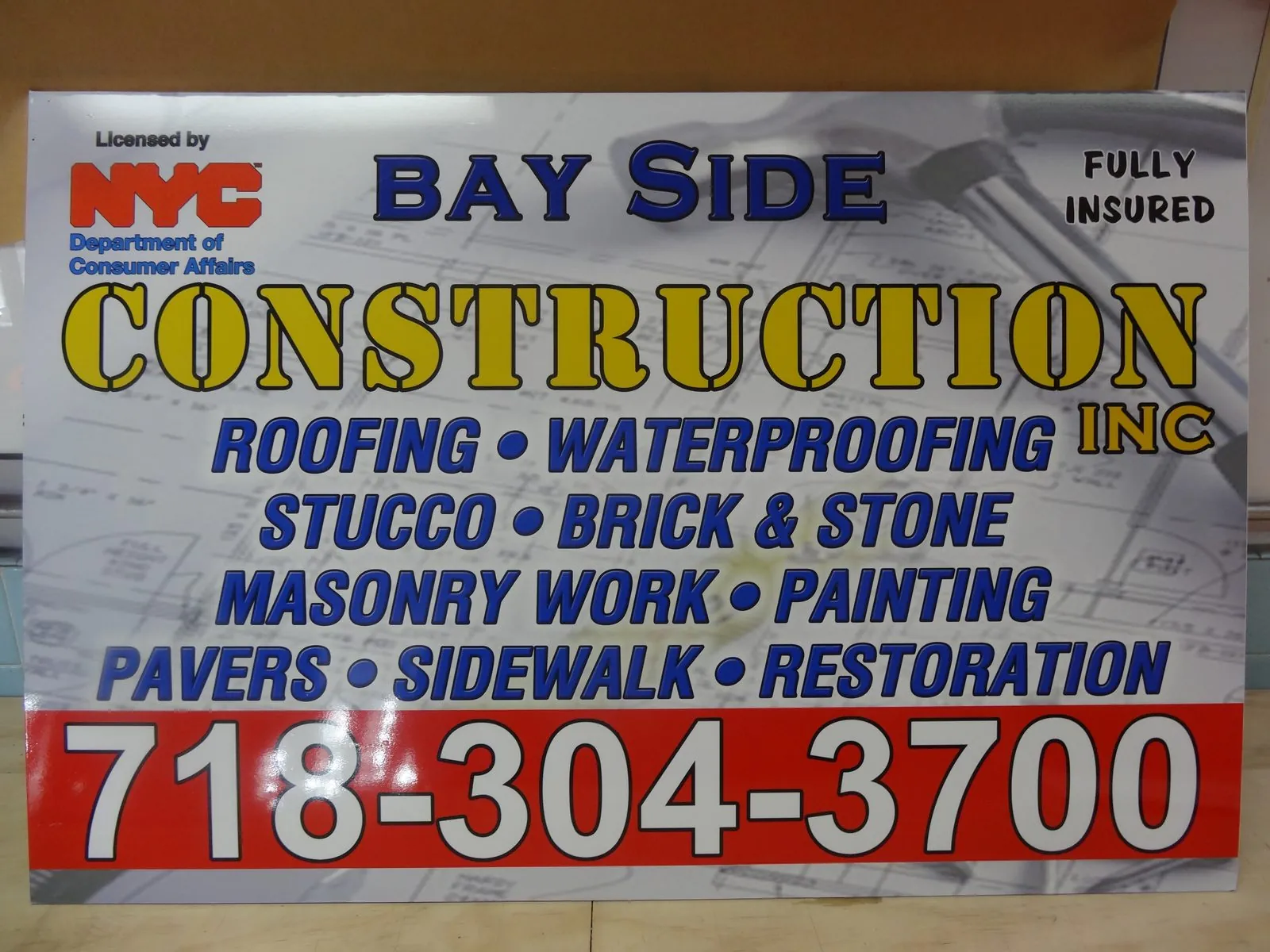 Contractor sign listing roofing, waterproofing, masonry and sidewalk work with a large phone number