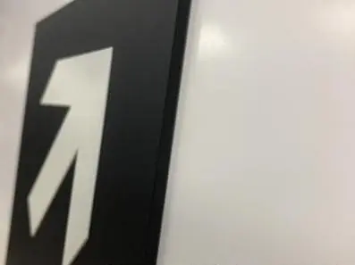 Black directional arrow sign