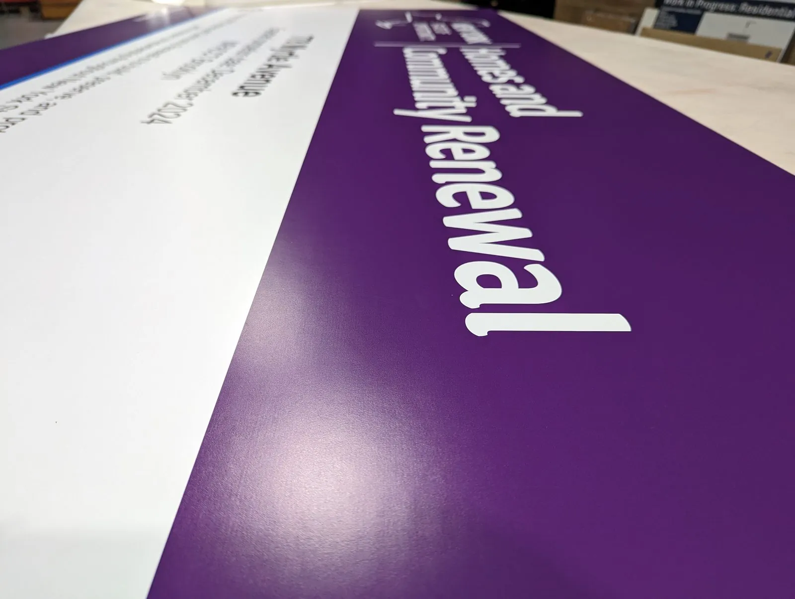 Large purple and white project panel printed in one piece on the shop table
