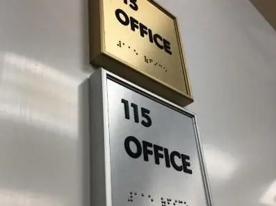 Gold and silver office ADA signs with braille