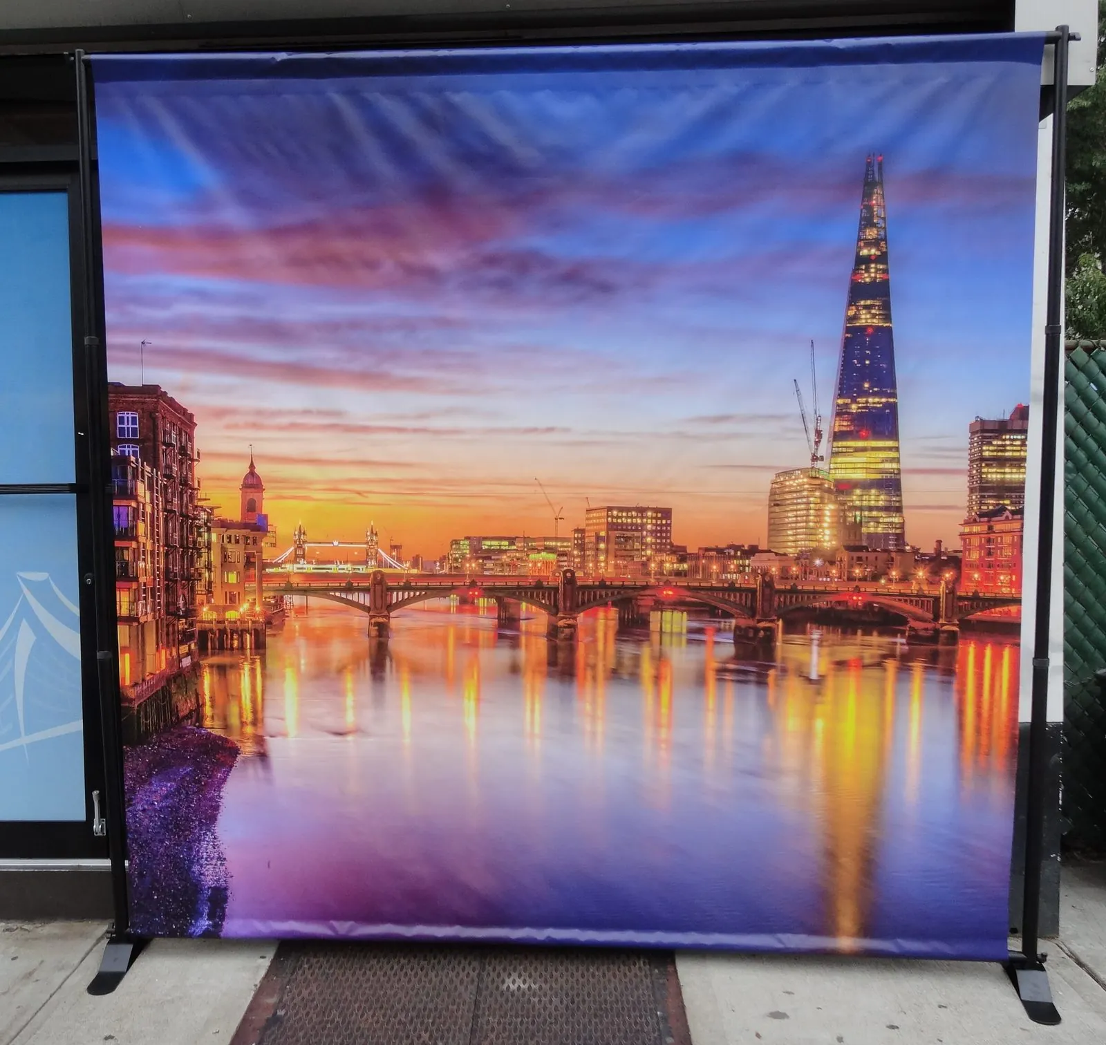 Backdrop printed with a city skyline at sunset, stretched tight on its frame