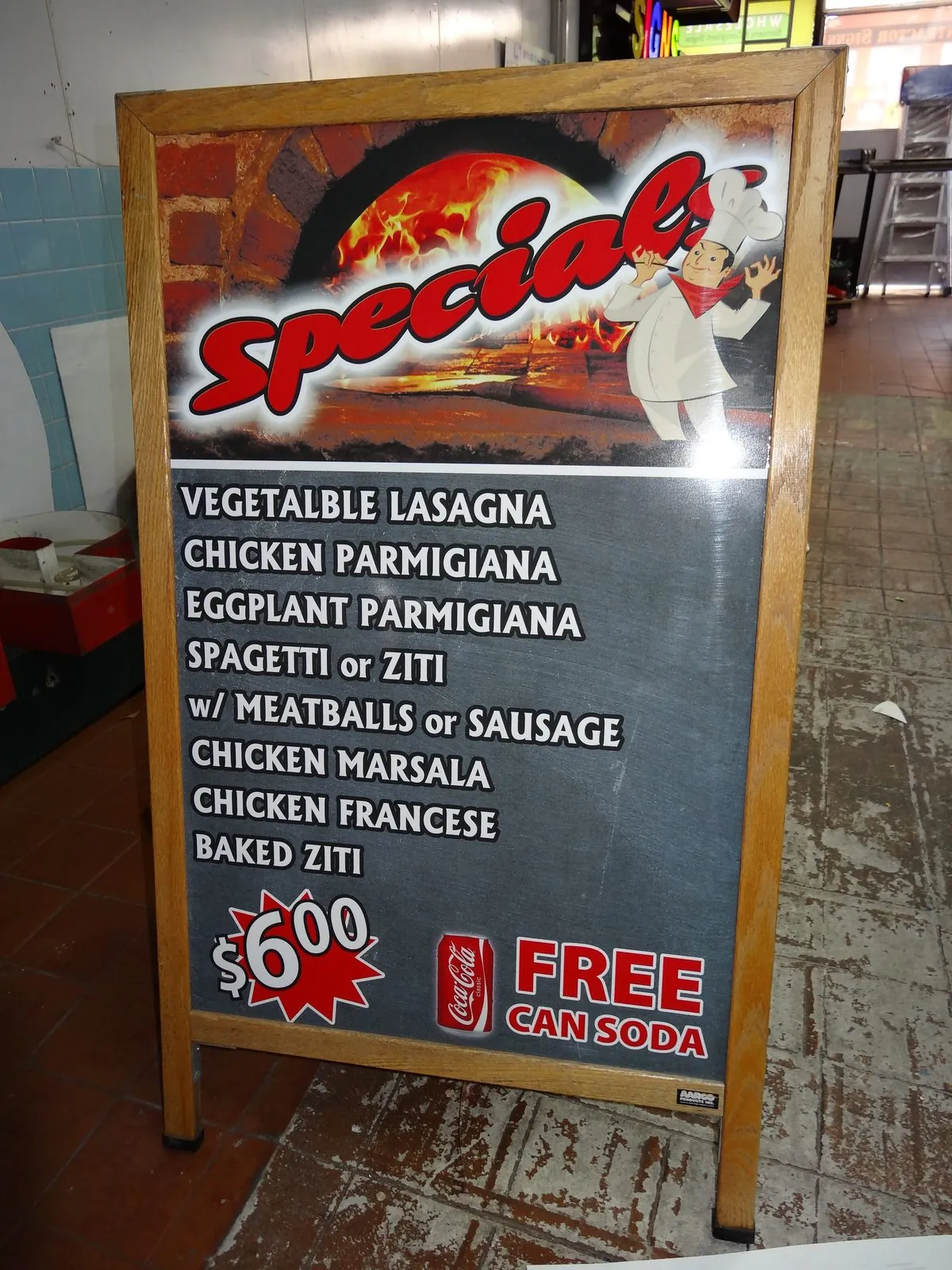 Wood frame A frame sign with a printed specials menu for an Italian restaurant